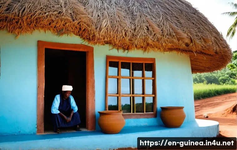 기니의 전통적인 건축 양식 - **Prompt:** A serene, sun-drenched scene showcasing a traditional Guinean dwelling. The home feature...